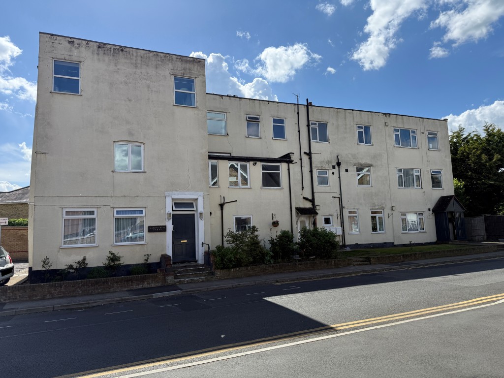 Lot: 128 - TWO-BEDROOM FLAT WITH GARAGE IN NEED OF UPDATING - View of Marley Croft from Moor Lane
